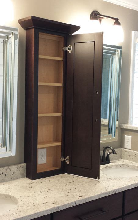 This bathroom storage cabinet boasts the understated molding, recessed panels, angled apron and tapered feet that characterize the manor grove collection. Bathroom Countertop Storage Cabinets Bathroom Storage ...