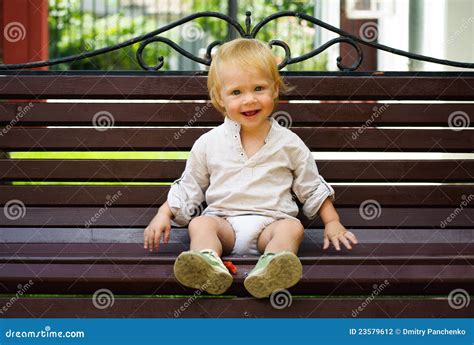 Cute Little Baby Sitting On Bench Stock Photography Image 23579612