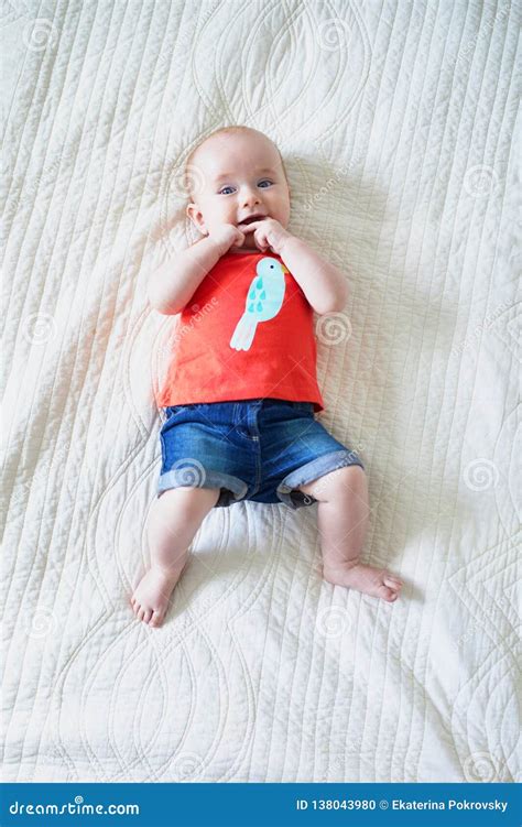 Six Months Old Baby Girl Lying On Her Back Stock Photo Image Of