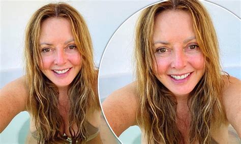 carol vorderman 60 shows off her ample assets in a busty nude bikini for a steamy hot tub