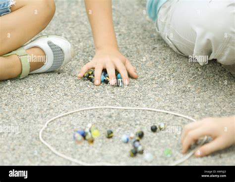 Children Playing Marbles Stock Photos And Children Playing Marbles Stock