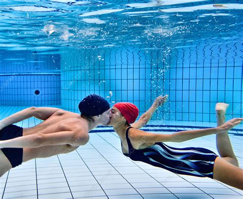 couple kissing in swimming pool stock image f005 1656 science photo library