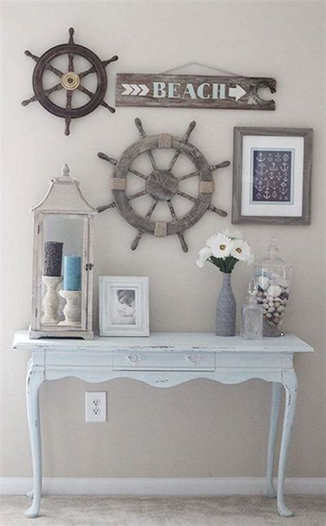 There Is A White Table With Pictures On It And A Ship Wheel Mounted To The Wall