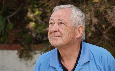 Outdoor Portrait Of Happy Healthy Senior 80 Year Old Caucasian Male