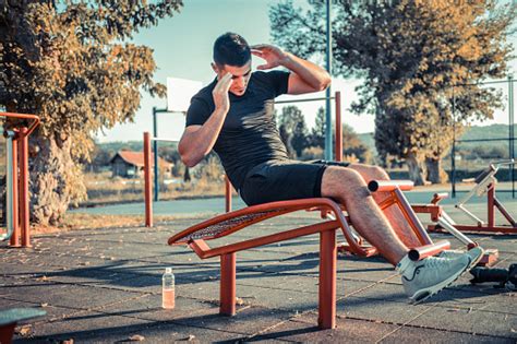 Photo Of Young Athletic Man Exercising Outdoors Stock Photo Download