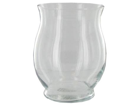 A Clear Glass Vase Sitting On Top Of A White Table