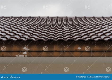 The Rain Falls On The Old Roof And Water Fell Into The Below Stock