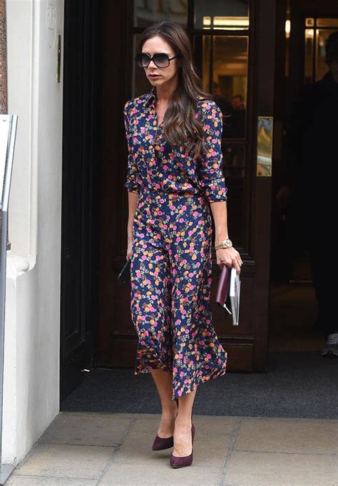 victoria beckham looks solemn while strutting her lean figure in flirty floral dress in london