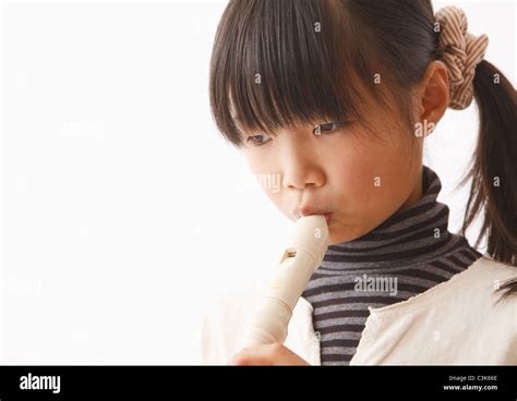Girl Playing Recorder Stock Photo Alamy