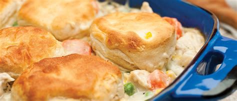 This chicken and biscuits cobbler uses that same technique with a creamy, savory mixture of chicken and veggies and a simple buttery drop biscuit to top it. Easy Chicken and Biscuits