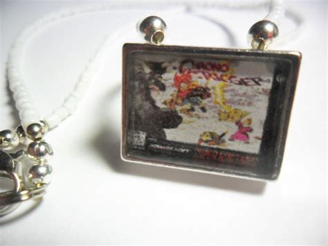 Maybe you would like to learn more about one of these? Chrono Trigger box art necklace by terrabranford82 on ...