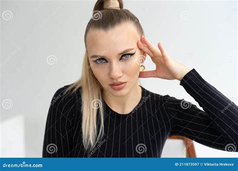 Portrait Of Fashionable Blond Woman Young Woman With Stern Look