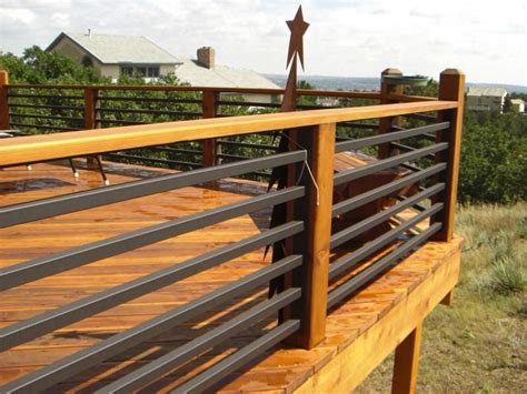 Helping you design a deck with baluster railings either metal or wood. cedar and metal | Railings outdoor, Patio railing, Deck ...