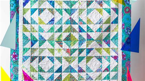 Jenny Demonstrates How To Make A Pretty Half Square Triangle Quilt