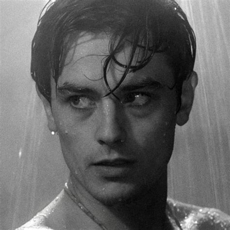 black and white photograph of a man in the shower with water pouring over his face