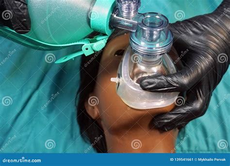 Medical Stuff In Black Gloves Performing Artificial Ventilation Using