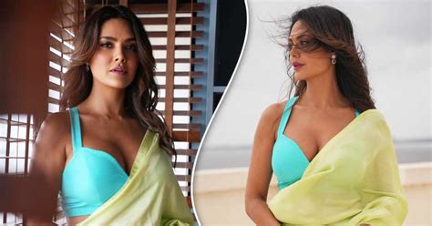 aashram fame esha gupta flaunts her voluptuous figure in a s xy saree with a cleav ge exposing