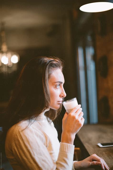 Portrait Of Real Woman Sitting In A Coffee Shop Del Colaborador De Stocksy Alexey Kuzma