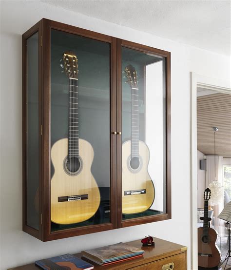 The market in australia is small for empty guitar speaker cabs. Guitar showcase by Carl Hansen & Søn | Guitar display ...