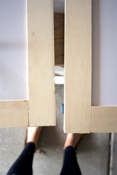 Trim of any type makes cabinet doors appear expensive. How to Add Trim and Paint Your Laminate Cabinets | brepurposed