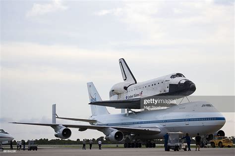Space Shuttle Atlantis Riding Atop A Modified 747 Aircraft Taxis To