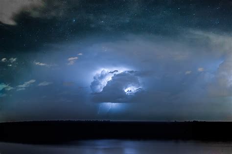 Clouds And Lightning On Starry Night Hd Wallpaper Background Image