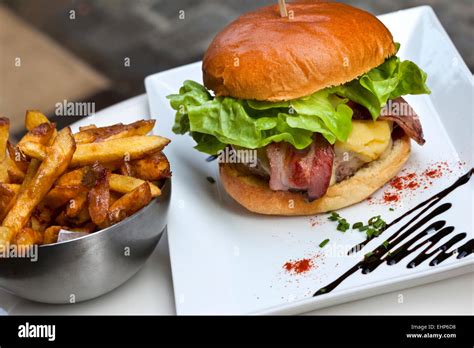 Hamburger And French Fries On A Plate Stock Photo Alamy