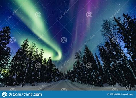 Colorful Polar Arctic Northern Lights Aurora Borealis Activity In Snow