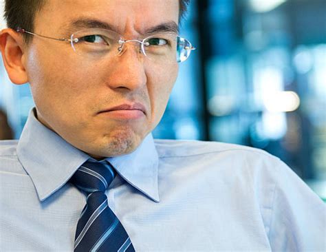 110 Young Asian Business Man Striking A Thinking Pose Stock Photos