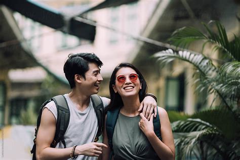 Asian Couple In Love Enjoying Vacation By Lumina
