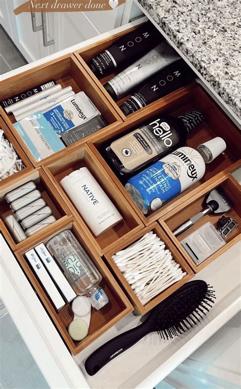 An Organized Drawer In A Bathroom With Toothbrushes Shampoos And Lotion