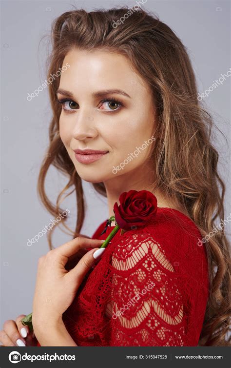 Beautiful Woman Holding Red Rose — Stock Photo © Gpointstudio 315947528