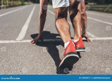 Cropped Image Of Male Sprinter In Starting Position Stock Image Image