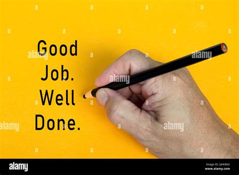 Male Hand Writes In Black Pencil The Word Good Job Well Done On A