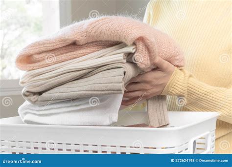 Housewife Asian Young Woman Hand In Many Folding Freshly Shirts Put