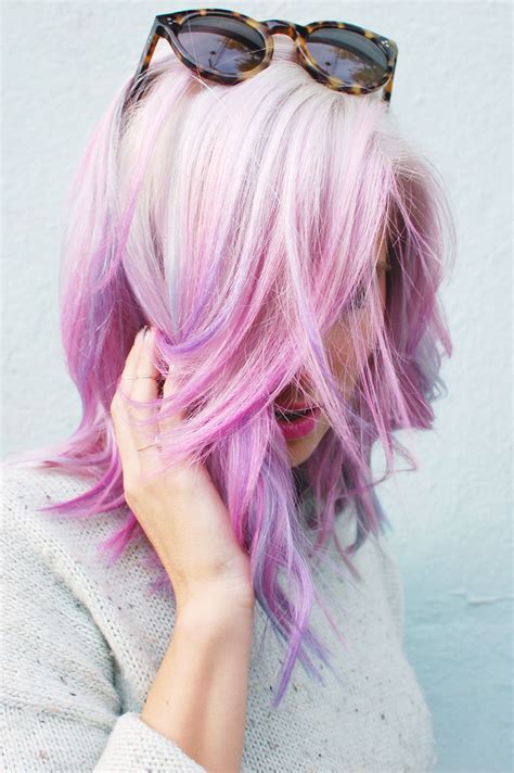 Short, platinum blonde haircut with shaved back and sides, and blue fringe. I generally get creative with my hair on my own, but every ...