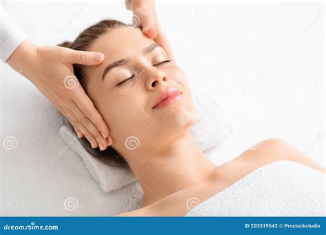 Joyful Young Woman Relaxing During Face Lifting Massage Copy Space Stock Image Image Of