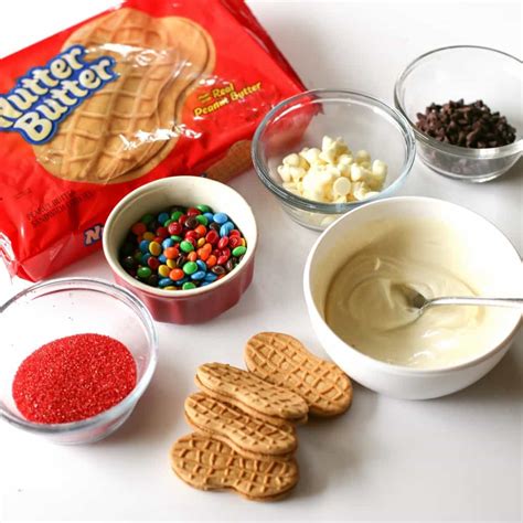Add the eyes and nose by applying some melted white chocolate. Santa Claus Cookies - The Girl Who Ate Everything