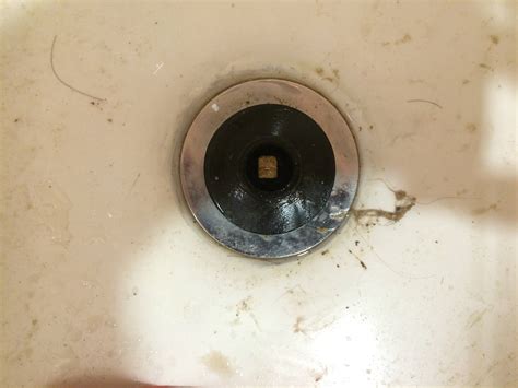 In order to plunge the drain, you will need to remove the overflow plate when a plunger fails to work, the remaining tools to correct a clogged bathtub require technical skills. plumbing - Remove old toe touch bathtub drain stopper with ...