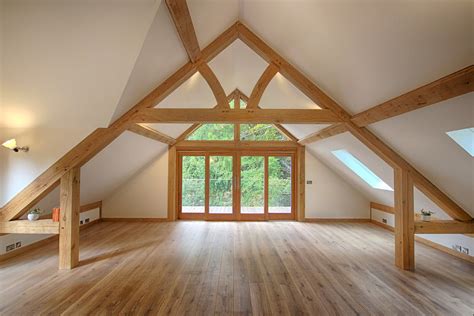inside an oak garage with room above featured trusses traditional patio doors and bi fold
