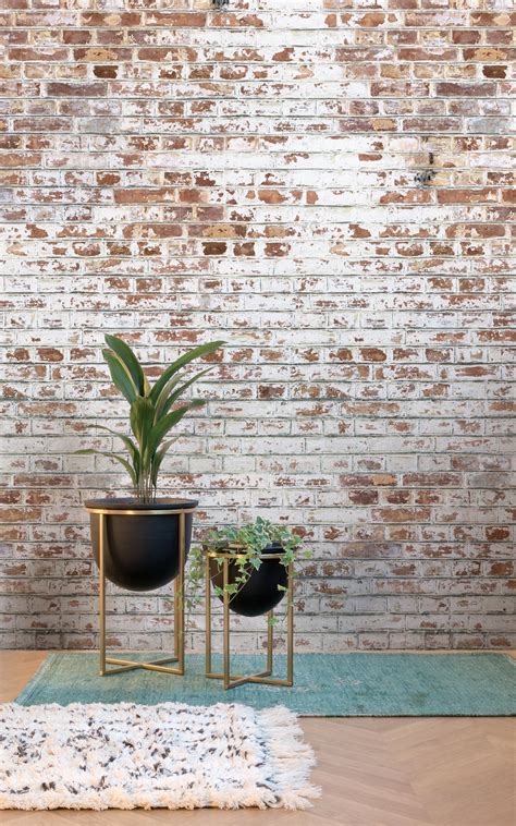Exposed and unpainted bricks almost always have lots of interesting textures and that makes them perfect for this interior. White Painted Brick Wallpaper Mural | Painted brick walls ...