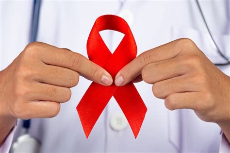 Free Photo The Doctor Holds A Red Ribbon Hiv Awareness Awareness World Aids Day And World