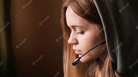 Premium Photo Portrait Of A Young Girl In A Hoodie And With A Headset