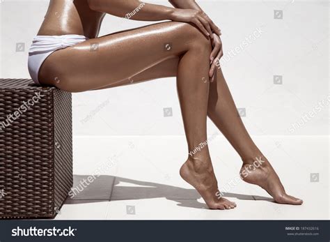 Beautiful Woman Tan Legs Against White Wall Stock Photo 187432616