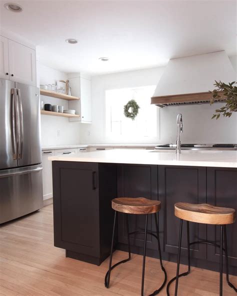 We started with some unfinished stock cabinets that we bought at lowe's. White kitchen, contrasting dark island. blue island. black ...