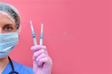 Woman Doctor With Insulin Syringes In Hand On A Red Background Copy
