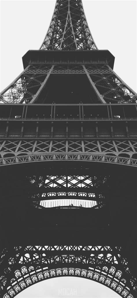 a black and white shot of the bottom of the eiffel tower eiffel tower bottom view zte axon 11