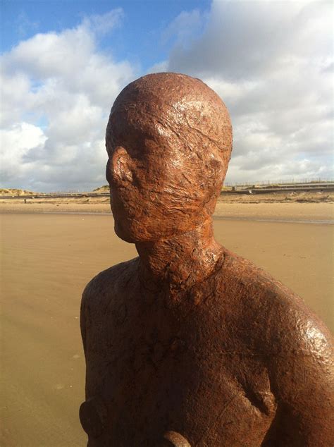 Anthony Gormley Another Place Iron Man Clouds Blue Sunny Day Sand