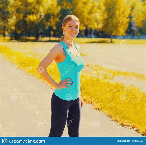 Fitness Smiling Young Woman Warming Up Before Exercises In The City Park Stock Image Image Of