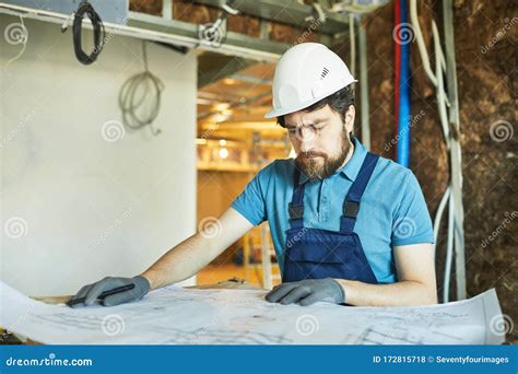 Bearded Contractor Looking At Floor Plans Stock Photo Image Of Work